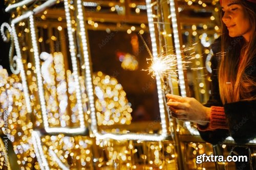 Woman Holding Sparkler Night While Celebrating Christmas Outside 6xJPEG