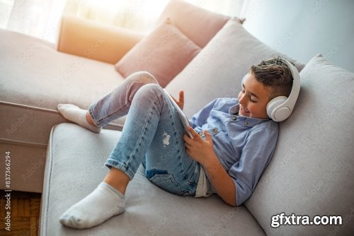 Little Boy In Headphones Listening To Music 6xJPEG