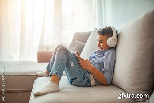 Little Boy In Headphones Listening To Music 6xJPEG