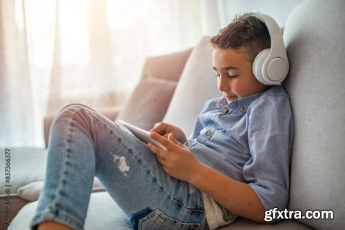 Little Boy In Headphones Listening To Music 6xJPEG