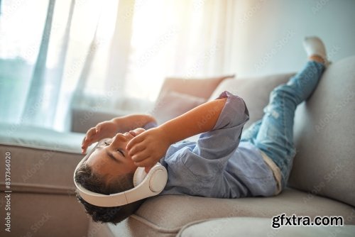 Little Boy In Headphones Listening To Music 6xJPEG