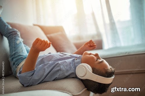 Little Boy In Headphones Listening To Music 6xJPEG