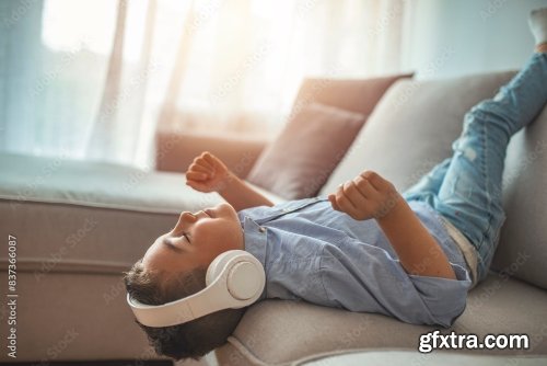 Little Boy In Headphones Listening To Music 6xJPEG