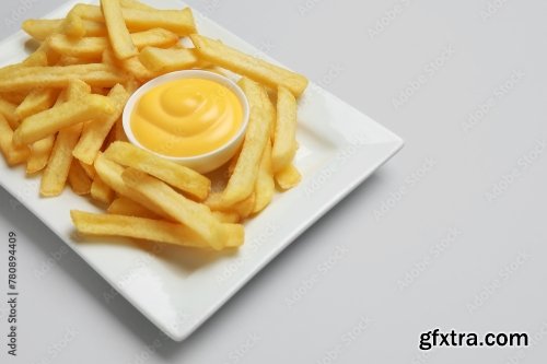 Plate With Golden French Fries And Cheese Sauce 6xJPEG