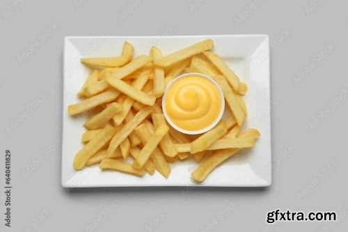 Plate With Golden French Fries And Cheese Sauce 6xJPEG