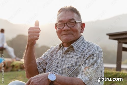 Asian Old Man Sitting And Relaxing 8xJPEG