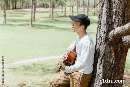 Asian Man Sitting And Singing 6xJPEG