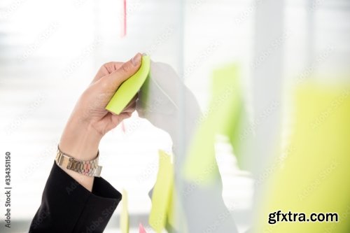 Business Woman Using Post It Note On Glossy White Board 4xJPEG