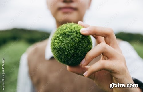 Asian Teenager Showing Earth On Hand 11xJPEG