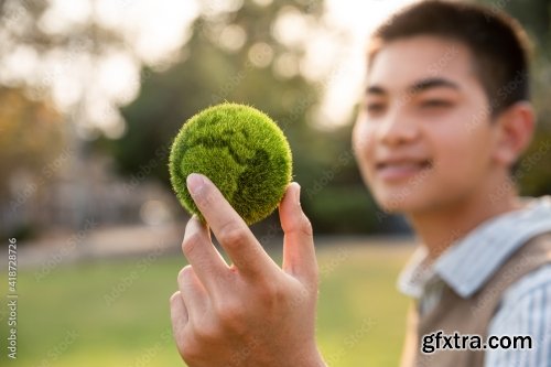 Asian Teenager Showing Earth On Hand 11xJPEG