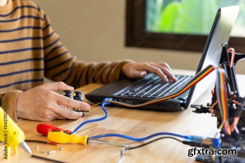 Young Man Code A Metal Car Robot And An Electronic Board 11xJPEG