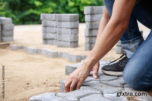 Hand Of Professional Paver Worker Lays Paving Stones In Layers For Pathway 8xJPEG