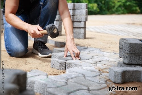 Hand Of Professional Paver Worker Lays Paving Stones In Layers For Pathway 8xJPEG