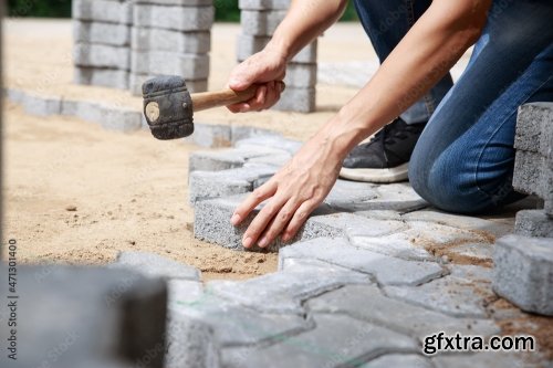 Hand Of Professional Paver Worker Lays Paving Stones In Layers For Pathway 8xJPEG