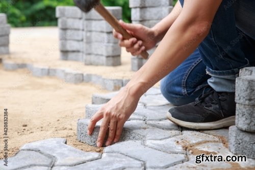 Hand Of Professional Paver Worker Lays Paving Stones In Layers For Pathway 8xJPEG