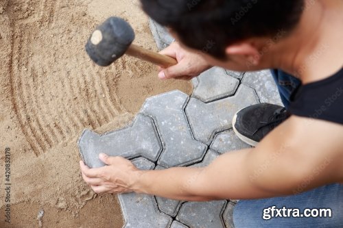 Hand Of Professional Paver Worker Lays Paving Stones In Layers For Pathway 8xJPEG