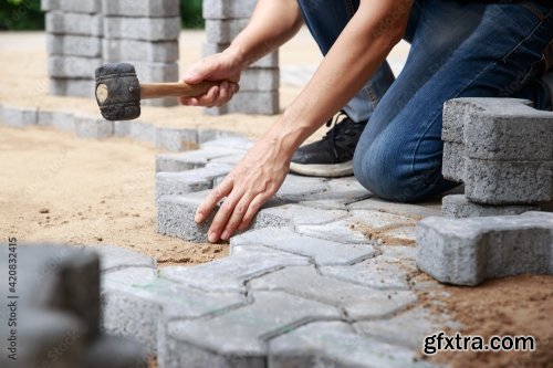 Hand Of Professional Paver Worker Lays Paving Stones In Layers For Pathway 8xJPEG