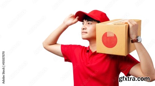 Portrait Of Young Handsome Asian Delivery Man Carrying Paper Parcel Standing On White Background 9xJPEG