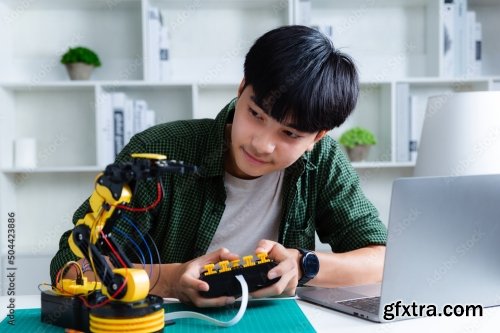 Asian Teenager Constructing Robot 7xJPEG