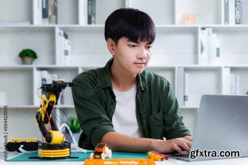 Asian Teenager Constructing Robot 7xJPEG