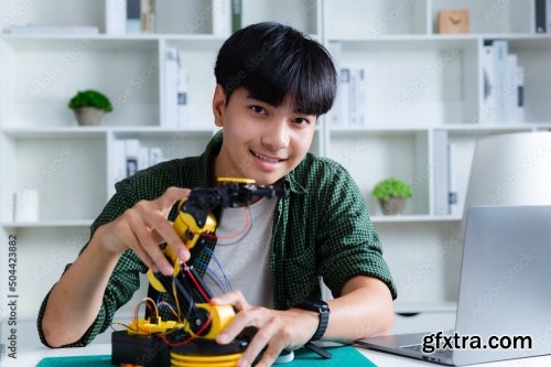 Asian Teenager Constructing Robot 7xJPEG