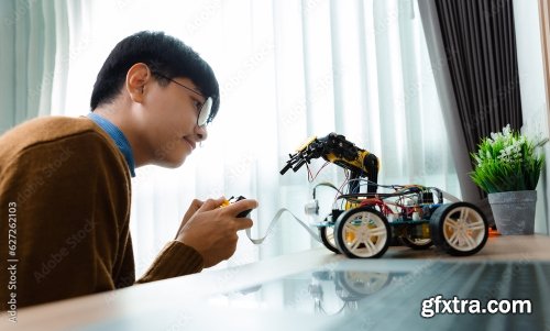 Asian Teenager Constructing Robot 7xJPEG