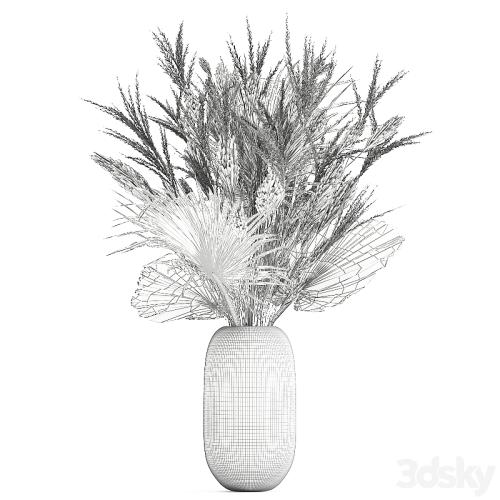 A beautiful bouquet of dried flowers in a glass vase with dry weinik branches and a dry palm leaf, branch . 150.