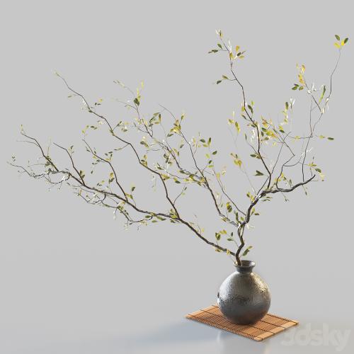 Plum branch in flower arrangement vase