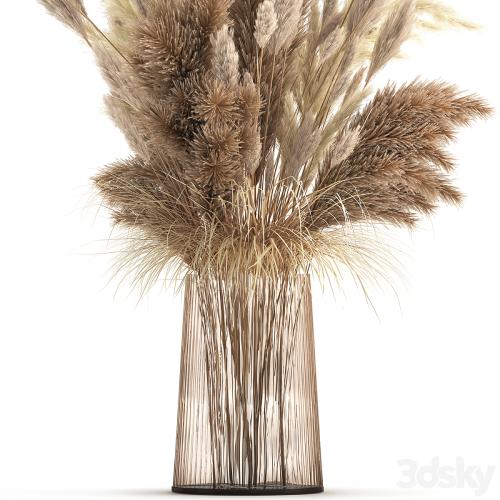 Beautiful lush bouquet of dried flowers in a vase with dry branches of pampas, Cortaderia, white reeds. 146.