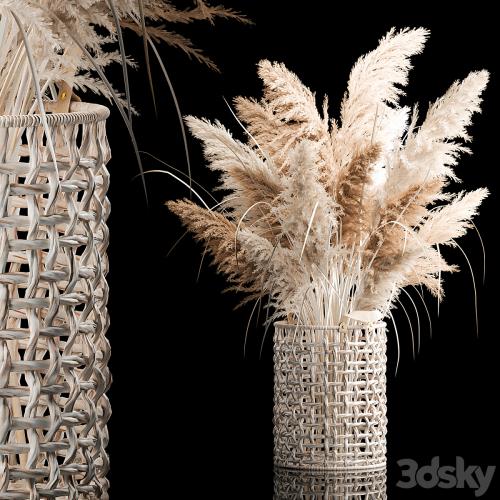 Bouquet of white dried flowers in a wicker basket, reeds, pampas grass, Cortaderia. 256.