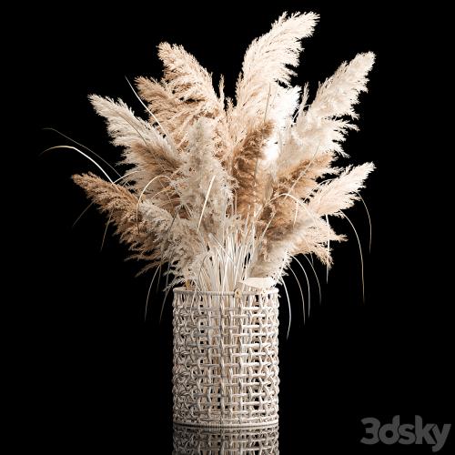 Bouquet of white dried flowers in a wicker basket, reeds, pampas grass, Cortaderia. 256.